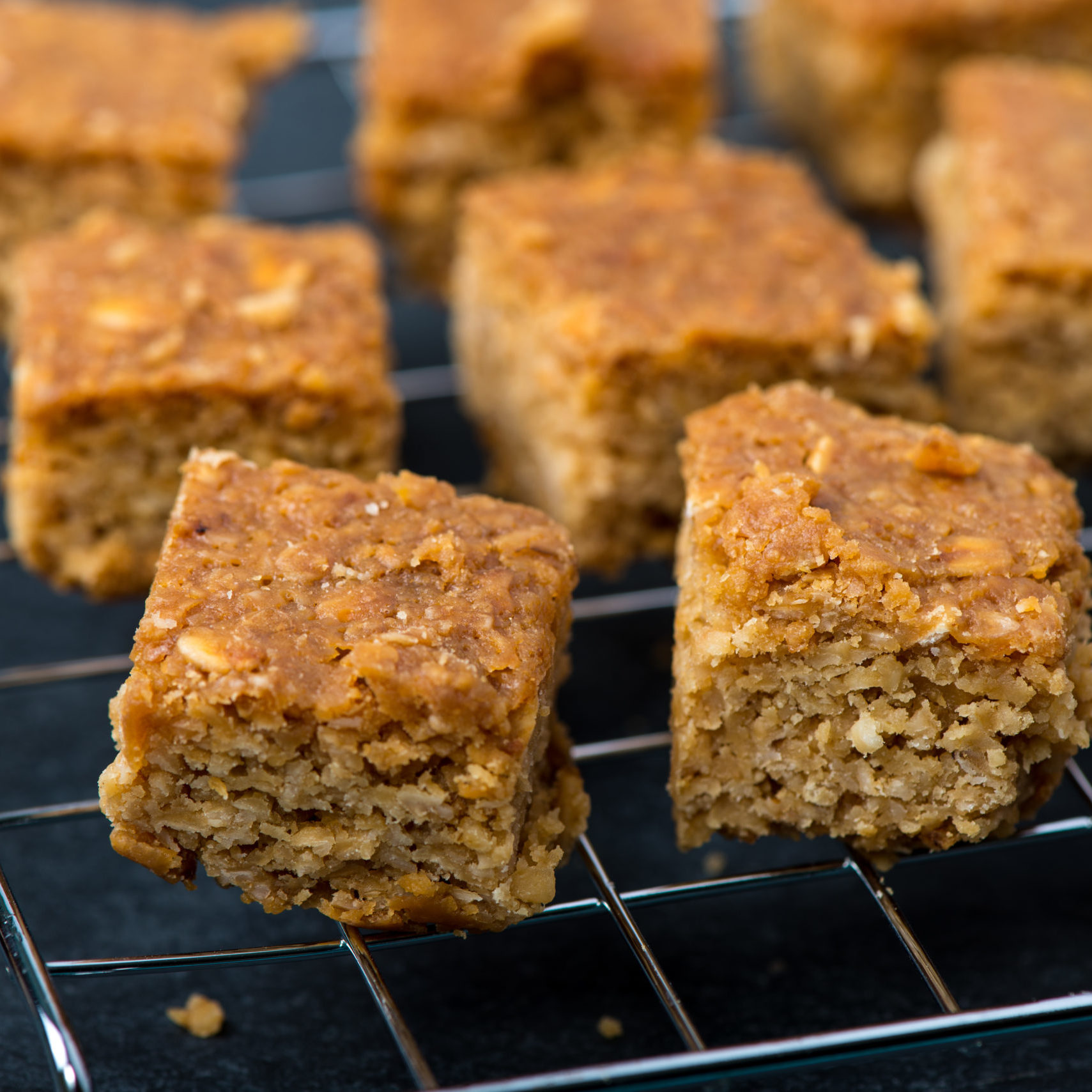 Homemade healthy flapjacks with honey on cooling rack
